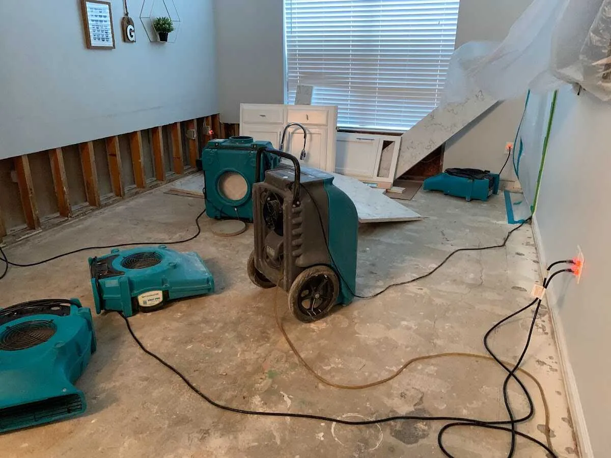 Dehumidifier in flood-cut room for Water Damage Restoration in Olivette
